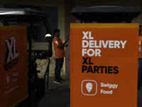 A Swiggy gig worker is seen during a promotional event in Mumbai, India, on October 14, 2024. IPO-bound Swiggy launches an XL fleet to cater...