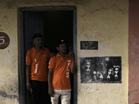 A Swiggy delivery person takes a mobile photograph at an event in Mumbai, India, on October 14, 2024. IPO-bound Swiggy launches an XL fleet...