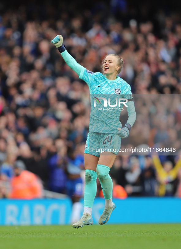 Chelsea goalkeeper Hannah Hampton celebrates in front of the Arsenal fans after the Barclays FA Women's Super League match between Arsenal a...