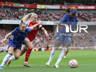 Kadeisha Buchanan of Chelsea beats Alessia Russo to the ball during the Barclays FA Women's Super League match between Arsenal and Chelsea a...