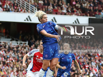 Millie Bright of Chelsea jumps for the ball during the Barclays FA Women's Super League match between Arsenal and Chelsea at the Emirates St...