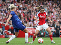 Chelsea's Millie Bright challenges Arsenal's Mariona Caldentey for the ball during the Barclays FA Women's Super League match between Arsena...