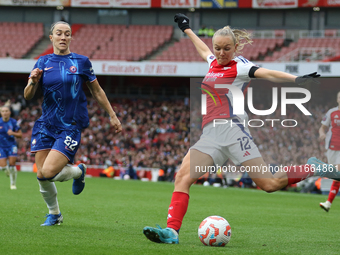 Chelsea's Lucy Bronze runs to stop Arsenal's Frida Maanum from putting the ball in during the Barclays FA Women's Super League match between...