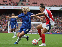 Erin Cuthbert of Chelsea fights Caitlin Foord for the ball during the Barclays FA Women's Super League match between Arsenal and Chelsea at...