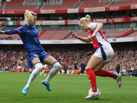 Chelsea substitute Nathalie Bjorn chases down Arsenal substitute Stina Blackstenius during the Barclays FA Women's Super League match betwee...