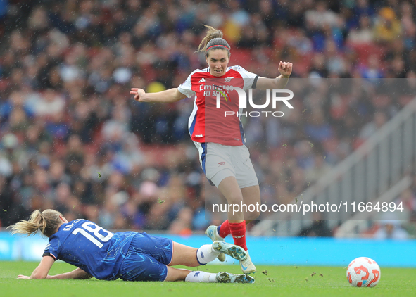 Wieke Kaptein slides Mariona Caldentey during the Barclays FA Women's Super League match between Arsenal and Chelsea at the Emirates Stadium...