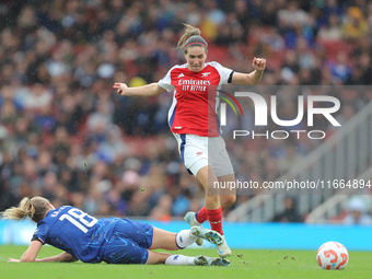 Wieke Kaptein slides Mariona Caldentey during the Barclays FA Women's Super League match between Arsenal and Chelsea at the Emirates Stadium...