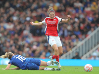 Wieke Kaptein slides Mariona Caldentey during the Barclays FA Women's Super League match between Arsenal and Chelsea at the Emirates Stadium...