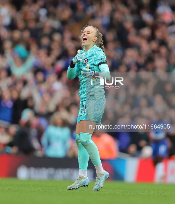 Chelsea goalkeeper Hannah Hampton celebrates in front of the Arsenal fans after the Barclays FA Women's Super League match between Arsenal a...