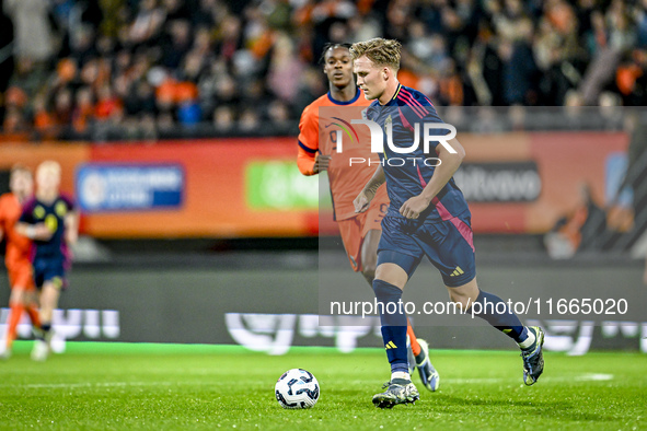 Sweden players Casper Widell and Jacob Ondrejka, and Netherlands player Devyne Rensch, participate in the match between Netherlands U21 and...