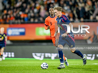 Sweden players Casper Widell and Jacob Ondrejka, and Netherlands player Devyne Rensch, participate in the match between Netherlands U21 and...