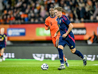 Sweden players Casper Widell and Jacob Ondrejka, and Netherlands player Devyne Rensch, participate in the match between Netherlands U21 and...