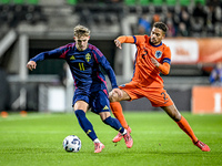 Sweden player Jacob Ondrejka and Netherlands player Devyne Rensch participate in the match between Netherlands U21 and Sweden U21 at the Gof...