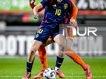 Sweden player Williot Swedberg and Netherlands player Rav van den Berg participate in the match between Netherlands U21 and Sweden U21 at th...