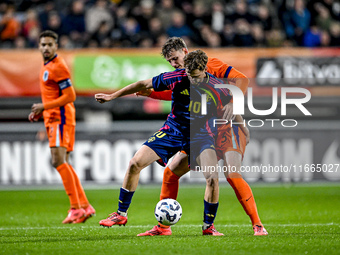 Sweden player Williot Swedberg and Netherlands player Rav van den Berg participate in the match between Netherlands U21 and Sweden U21 at th...