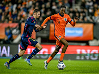 Sweden player Noah Eile and Netherlands player Emmanuel Emegha participate in the match between Netherlands U21 and Sweden U21 at the Goffer...