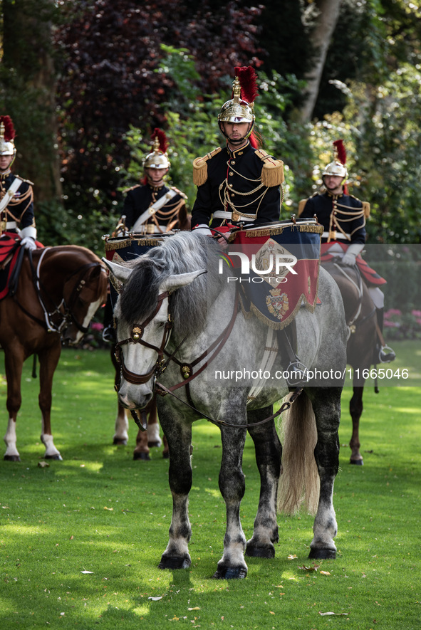 The garden of the Hotel de Matignon welcomes the Belgian sovereigns, King Philippe and Queen Mathilde, who are greeted by Premier Michel Bar...