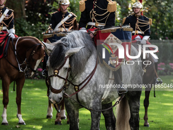 The garden of the Hotel de Matignon welcomes the Belgian sovereigns, King Philippe and Queen Mathilde, who are greeted by Premier Michel Bar...