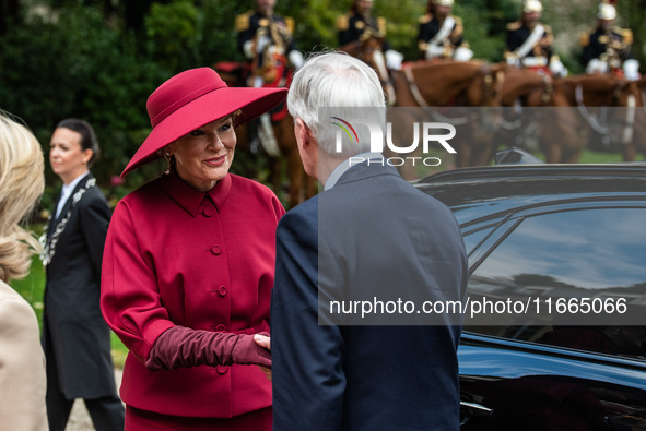 King Philip of the Belgians and Queen Mathilde are welcomed by Premier Michel Barnier and his wife Isabelle Altamayer in Paris, France, on O...