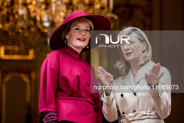 Queen Mathilde of the Belgians and Isabelle Altamayer, wife of French Premier Michel Barnier, are at the Hotel de Matignon during the visit...