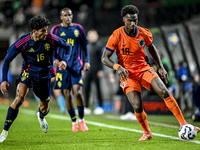 Sweden player Ahmed Qasem and Netherlands player Ezechiel Banzuzi participate in the match between Netherlands U21 and Sweden U21 at the Gof...