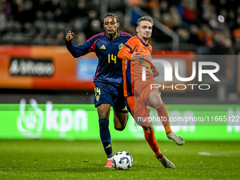 Sweden player Amar Fatah and Netherlands player Kenneth Taylor participate in the match between Netherlands U21 and Sweden U21 at the Goffer...