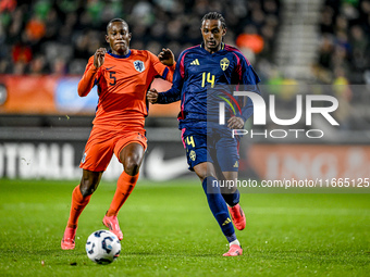 Netherlands player Neraysho Kasanwirjo and Sweden player Amar Fatah participate in the match between Netherlands U21 and Sweden U21 at the G...