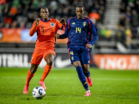 Netherlands player Neraysho Kasanwirjo and Sweden player Amar Fatah participate in the match between Netherlands U21 and Sweden U21 at the G...