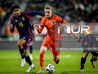 Sweden player Ahmed Qasem and Netherlands player Kenneth Taylor participate in the match between Netherlands U21 and Sweden U21 at the Goffe...