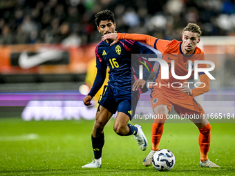 Sweden player Ahmed Qasem and Netherlands player Kenneth Taylor participate in the match between Netherlands U21 and Sweden U21 at the Goffe...