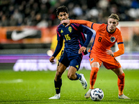 Sweden player Ahmed Qasem and Netherlands player Kenneth Taylor participate in the match between Netherlands U21 and Sweden U21 at the Goffe...