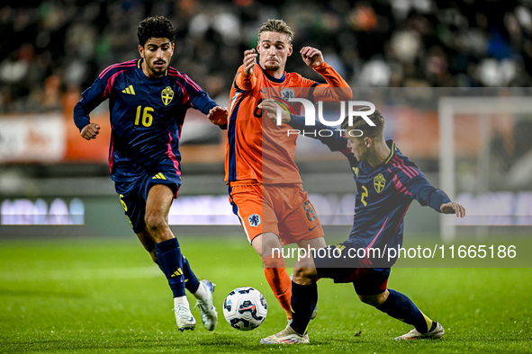 Sweden player Ahmed Qasem, Netherlands player Kenneth Taylor, and Sweden player Samuel Dahl are present during the match between Netherlands...