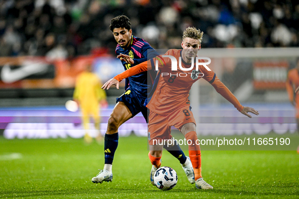 Sweden player Ahmed Qasem and Netherlands player Kenneth Taylor participate in the match between Netherlands U21 and Sweden U21 at the Goffe...