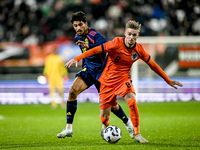 Sweden player Ahmed Qasem and Netherlands player Kenneth Taylor participate in the match between Netherlands U21 and Sweden U21 at the Goffe...