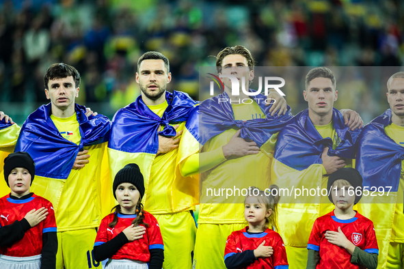 The Ukraine team plays during a football match of the UEFA Nations League between the Ukraine and Czechia national teams in Wroclaw, Poland,...