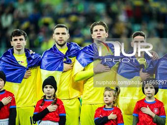 The Ukraine team plays during a football match of the UEFA Nations League between the Ukraine and Czechia national teams in Wroclaw, Poland,...