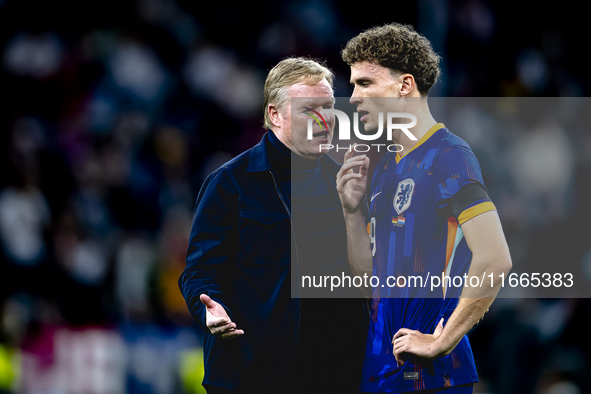 Netherlands trainer Ronald Koeman and Netherlands midfielder Mats Wieffer participate during the match between Germany and the Netherlands a...