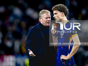 Netherlands trainer Ronald Koeman and Netherlands midfielder Mats Wieffer participate during the match between Germany and the Netherlands a...