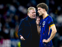 Netherlands trainer Ronald Koeman and Netherlands midfielder Mats Wieffer participate during the match between Germany and the Netherlands a...