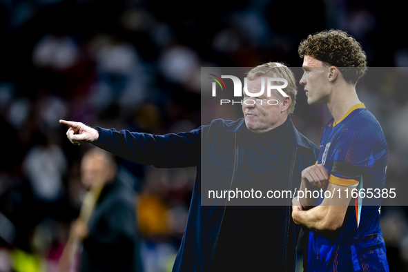 Netherlands trainer Ronald Koeman and Netherlands midfielder Mats Wieffer participate during the match between Germany and the Netherlands a...