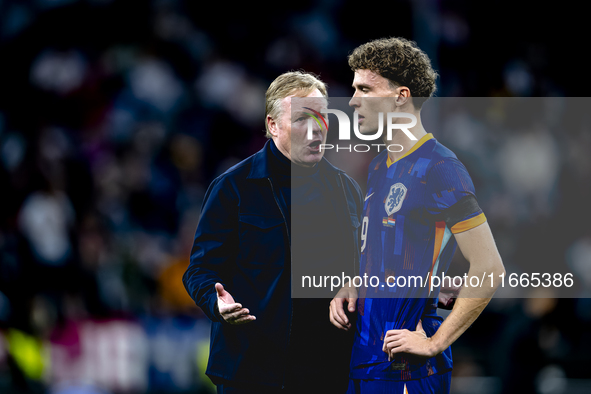 Netherlands trainer Ronald Koeman and Netherlands midfielder Mats Wieffer participate during the match between Germany and the Netherlands a...