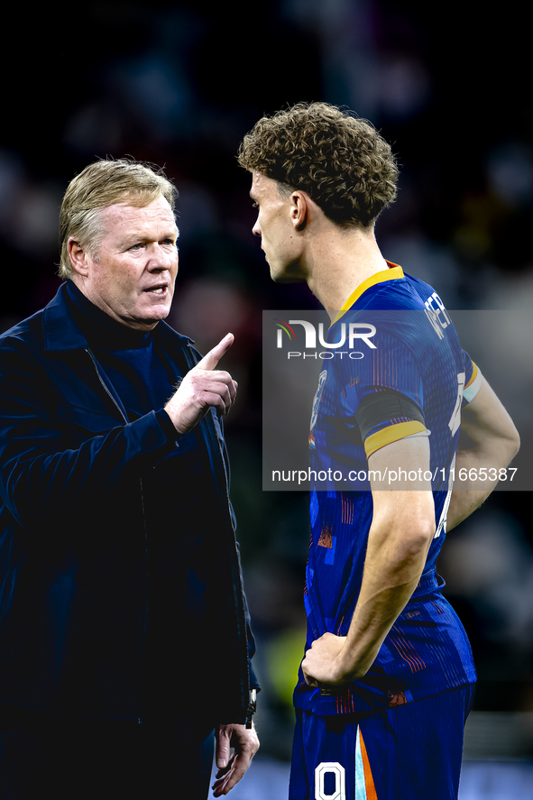 Netherlands trainer Ronald Koeman and Netherlands midfielder Mats Wieffer participate during the match between Germany and the Netherlands a...