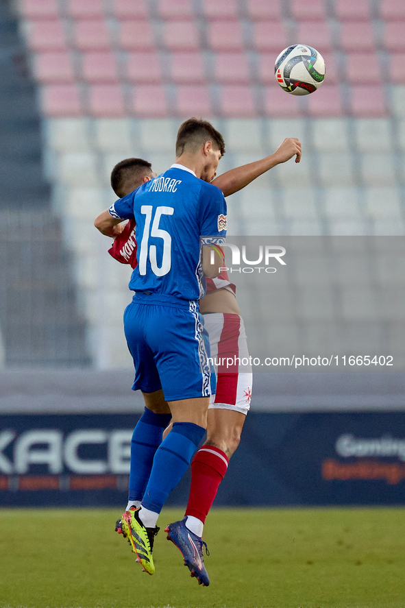 Victor Mudrac of Moldova vies for the ball with Luke Montebello of Malta during the UEFA Nations League, League D, Group D2 soccer match bet...