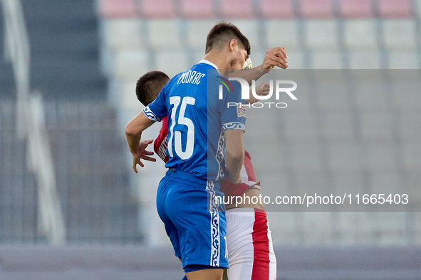 Victor Mudrac of Moldova vies for the ball with Luke Montebello of Malta during the UEFA Nations League, League D, Group D2 soccer match bet...