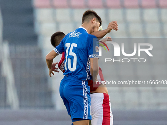 Victor Mudrac of Moldova vies for the ball with Luke Montebello of Malta during the UEFA Nations League, League D, Group D2 soccer match bet...