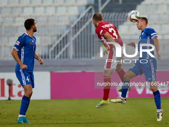 In Ta' Qali, Malta, on October 13, 2024, Sergiu Platica of Moldova heads the ball during the UEFA Nations League, League D, Group D2 soccer...