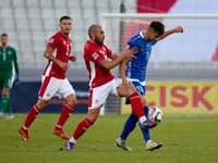 Mihail Caimacov of Moldova controls the ball despite the close challenge from Teddy Teuma of Malta during the UEFA Nations League, League D,...