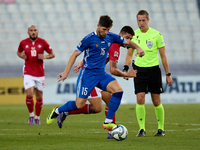 Victor Mudrac of Moldova vies for the ball with Luke Montebello of Malta during the UEFA Nations League, League D, Group D2 soccer match bet...