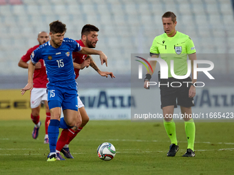 Victor Mudrac of Moldova vies for the ball with Luke Montebello of Malta during the UEFA Nations League, League D, Group D2 soccer match bet...