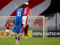 In Ta' Qali, Malta, on October 13, 2024, Vitalie Damascan of Moldova vies for the ball with Kurt Shaw of Malta during the UEFA Nations Leagu...